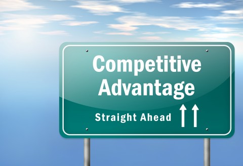 billboard road sign with text "competitve advantage straight ahead"
